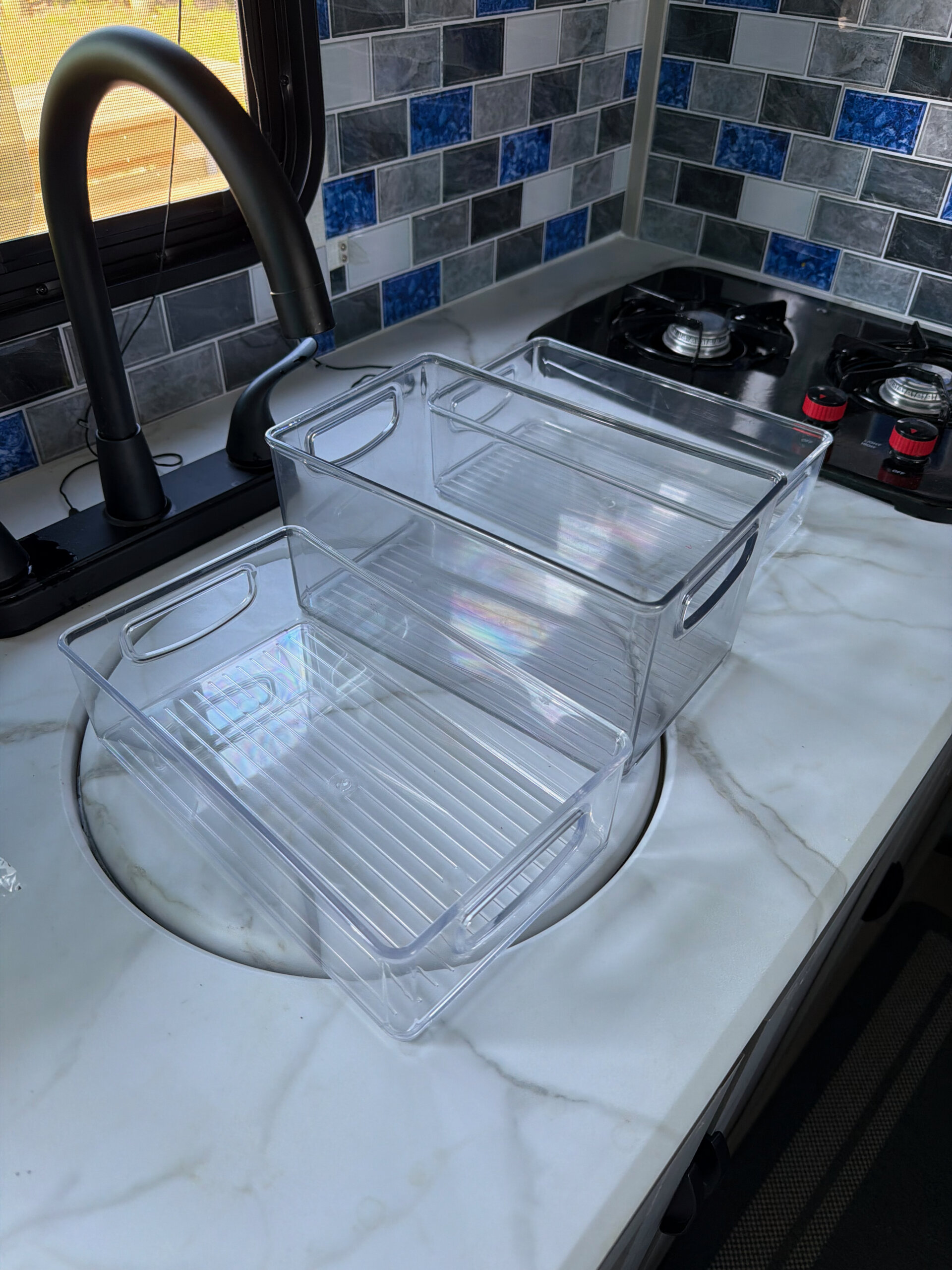 Inside the camper galley, small but functional, until the burner gets fussy.