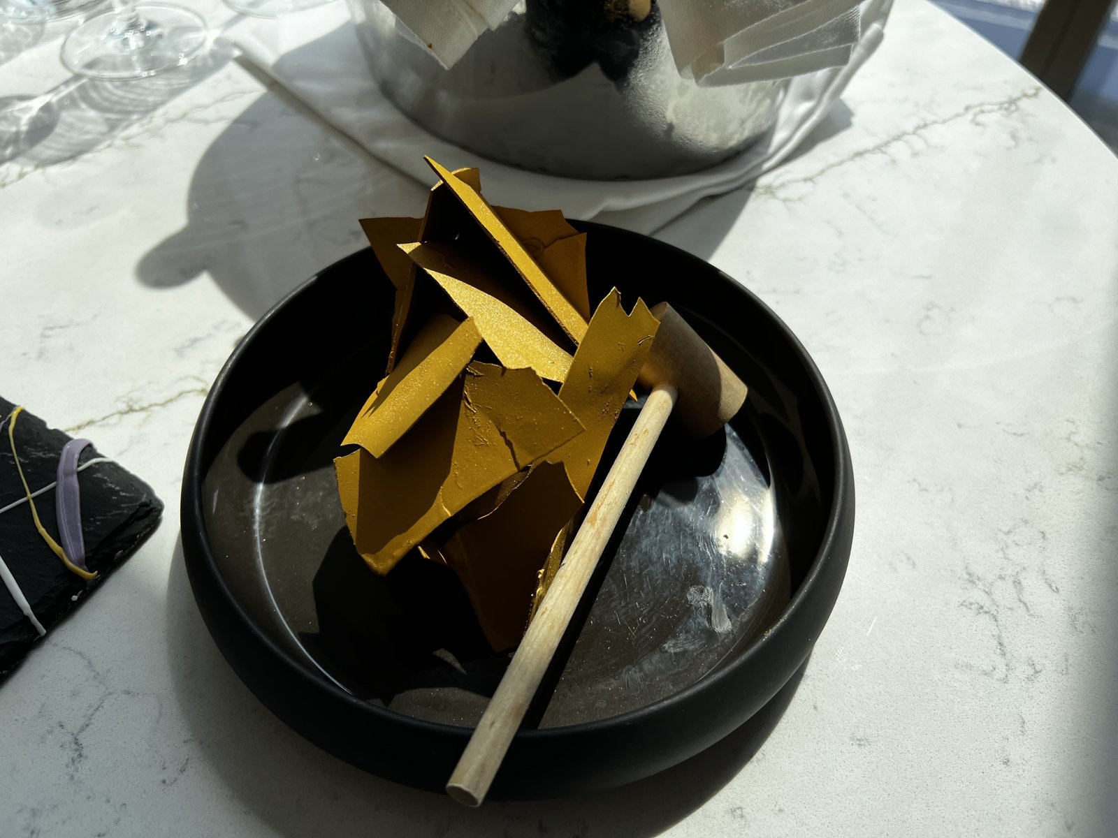 The break-open chocolate, gold shards under the shell