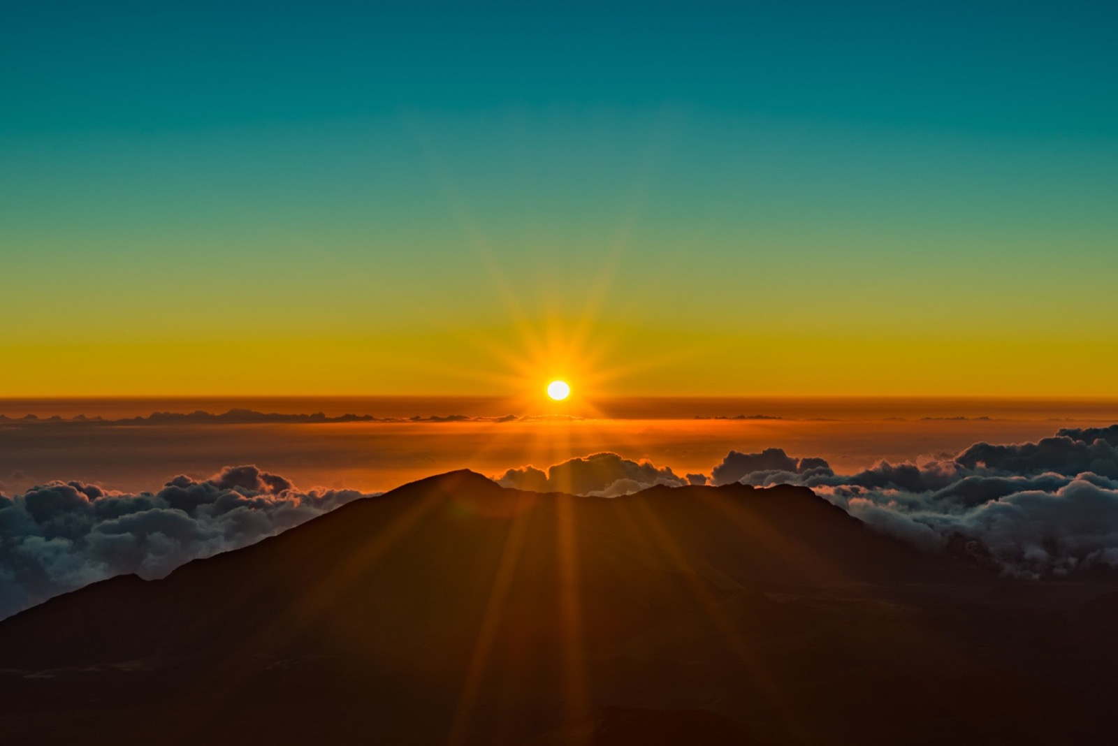 Sunrise above the clouds at Haleakalā, Maui